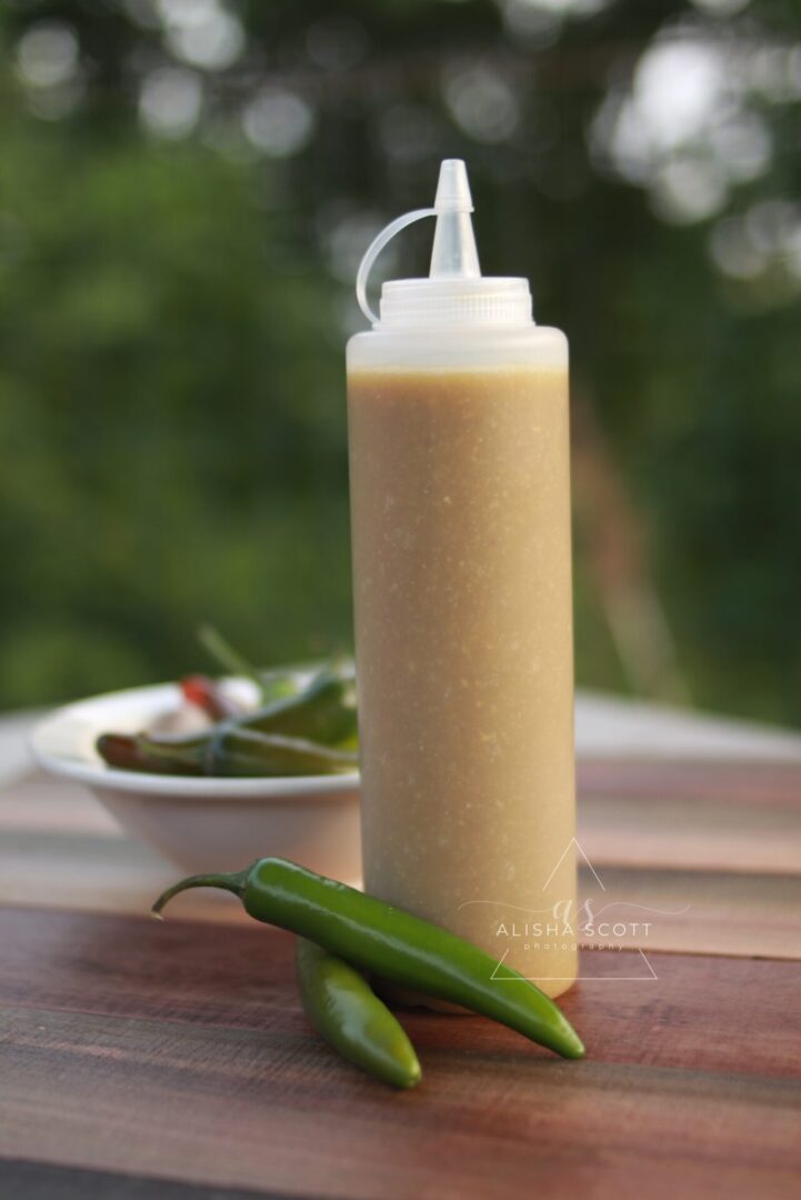 Spicy green chili sauce in a bottle.