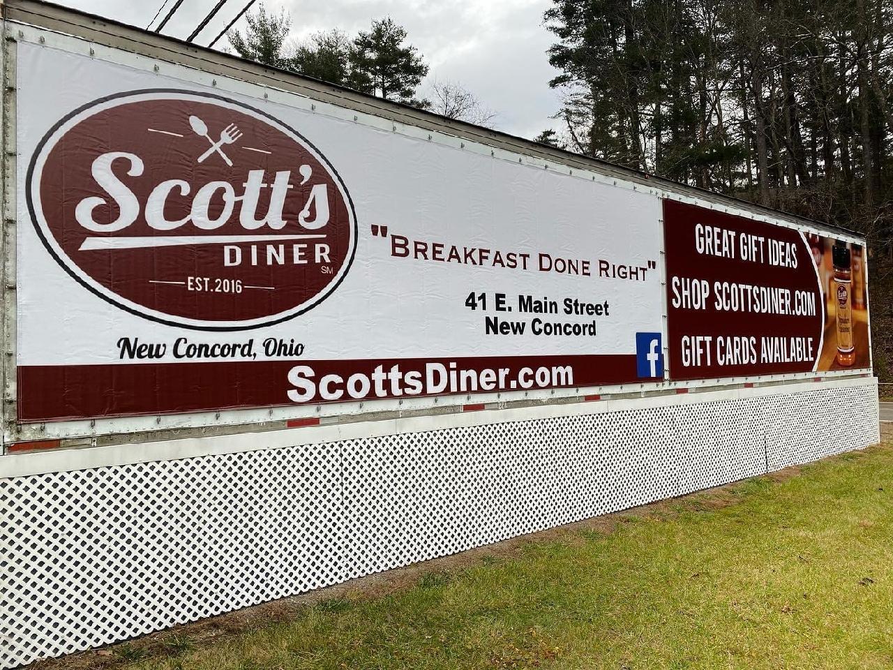 Scott's Diner sign with address and website.